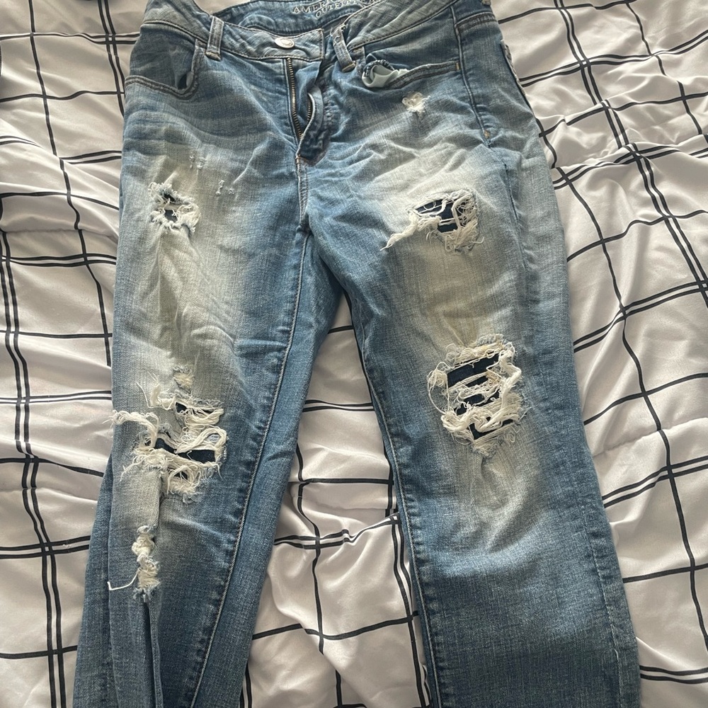 Women’s capri jeans with rips all the way down the pants